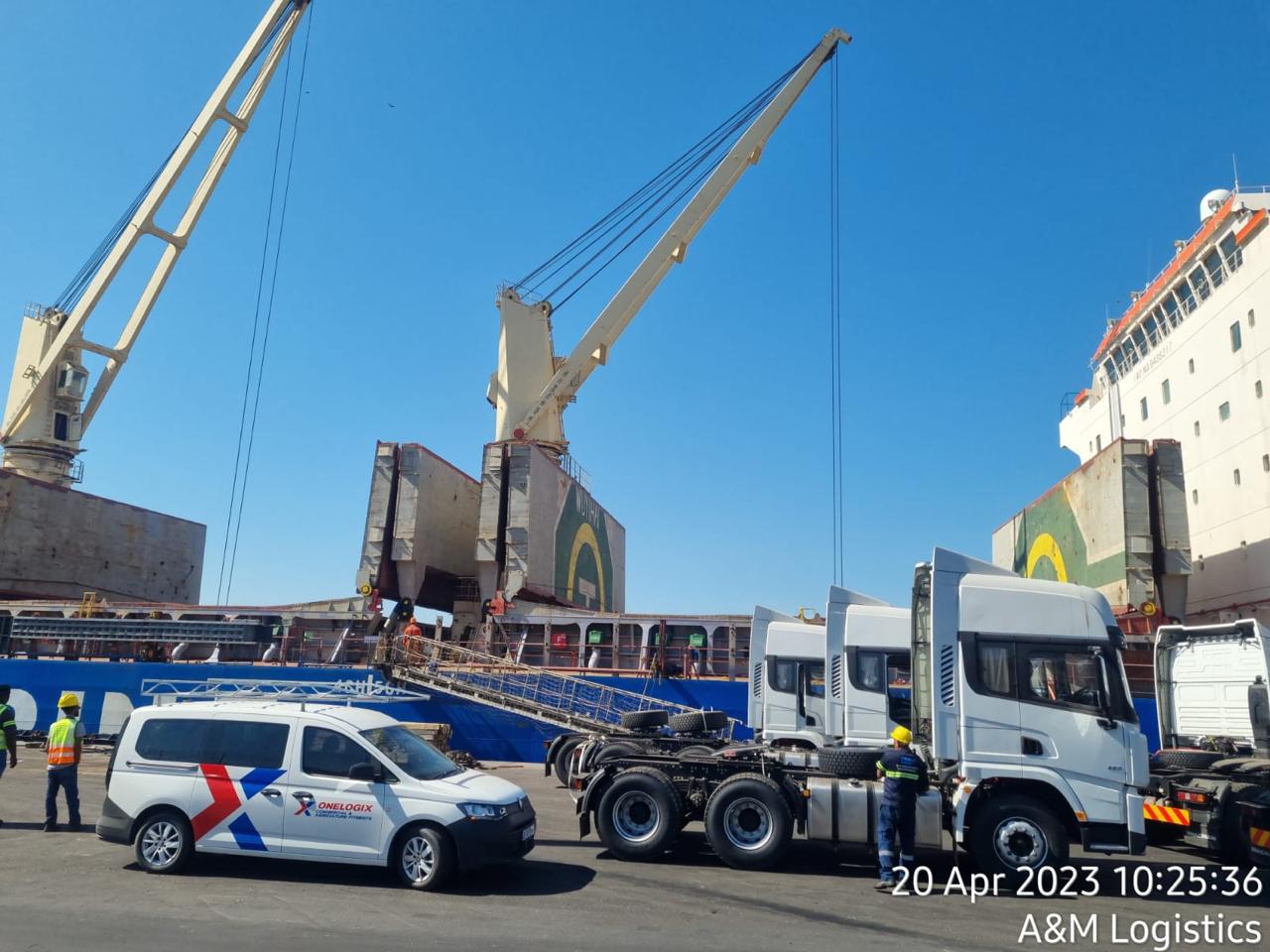 Active quayside shipping port backdrop with cargo containers and transport fleet